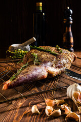 Marinated lamb leg with spice and herbs, olive oil and garlic
