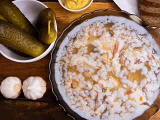 isolated aspic from pork meat beef and chicken on the table. appetizer of Ukrainian, European cuisine. jelly