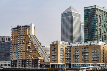 Fototapeta na wymiar Flats and houses along the River Thames, river side apartments in London, Great Britain