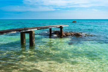 wooden bridge and sea beach with sky at Koh MunNork Island, Rayong, Thailand