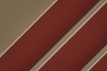 Pattern of brown pencils at grey background