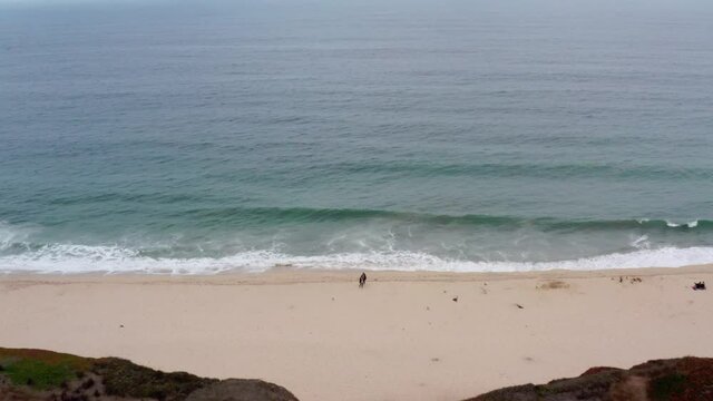 AERIAL: drone, half moon bay beach cliffs, and shore, drone view
