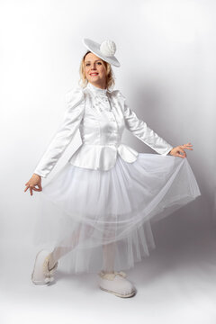 Young Happy Woman In White Fancy Dress And Hat On White Background. Fancy Dress.