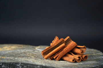 accepted cinnamon on marble background black background healthy foods category
