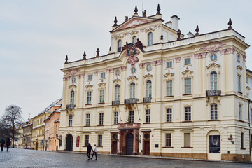 Fototapeta na wymiar Prague, Czech Republic - January 7 2021: Empty Hradčanské square in front of Prague Castle is surrounded by Schwarzenberg and Arcibishop palaces 