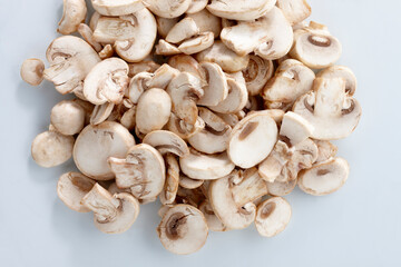 mushrooms cut in pieces on a white background