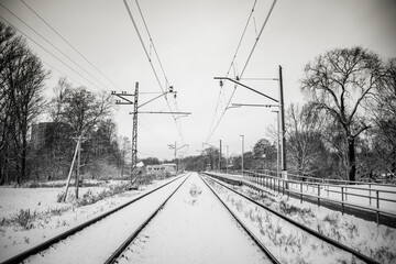 Electric Train Tracks Covered With Snow in Mid Winter