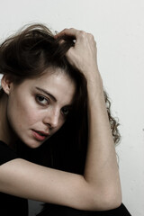 Fototapeta premium Portrait of woman. Model holds her head