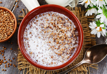 Buckwheat porridge with milk - 406931889