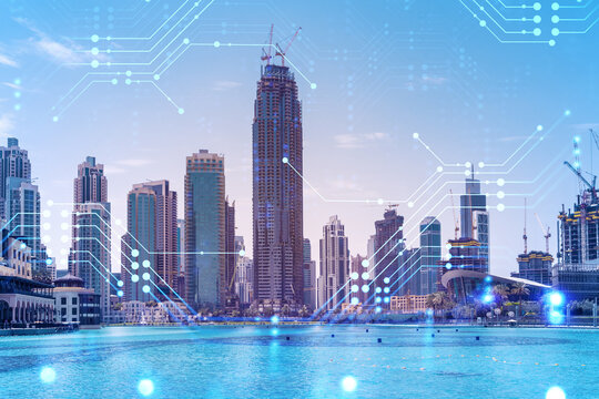 Skyscrapers of Dubai business downtown. International hub of trading and financial services. Technology theme icons hologram, Fintech concept. Double exposure. Dubai Canal waterfront.