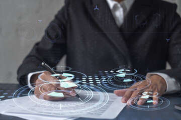 African American businesswoman is signing a contract to create a new software to present it in start up conference and gain investments to create a product. Technological graph over the desk.