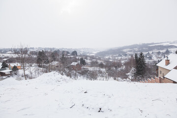 Fototapeta na wymiar Rural winter landscape of snowy day, village in the Serbia