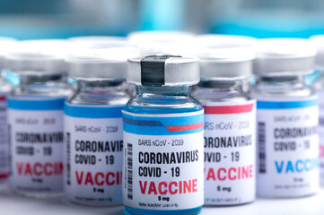 virus vaccine development of a coronavirus COVID-19, vaccine bottle in concept of insurance and fight against coronavirus 2019 ncov cure, medical research in laboratory to stop the spread of the virus
