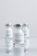 Corona Virus vaccine bottles. Vaccination, immunization, treatment to cure Covid 19 infection. Healthcare And Medical concept.