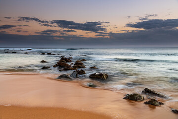 Sunset, rocks and the sea