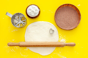 Making strawberry gift pie for valentine's day. Products for the pie are flour, sugar, butter and...