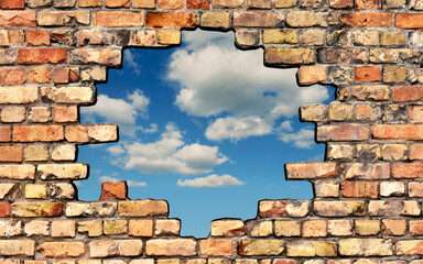 Fototapety  Freiheit - Loch in der Ziegelwand mit Wolkenhimmel im Hintergrund