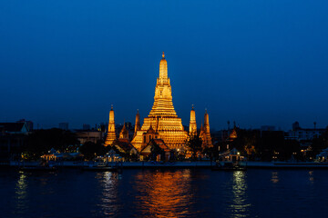 Arun temple Chao Phraya river sunset time with blue sky