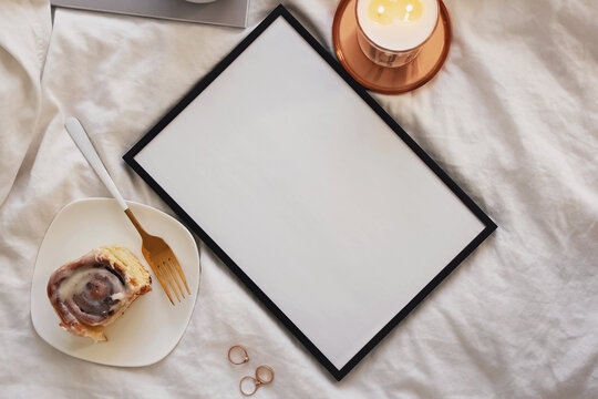 Empty frame with place for text and on the bed
