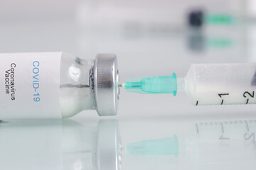 Corona Virus vaccine bottles. Vaccination, immunization, treatment to cure Covid 19 infection....