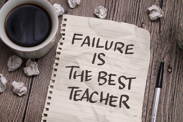 Failure is the best teacher, text words typography written on paper against wooden background, life and business motivational inspirational