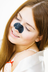 Woman with nose mask pore strips