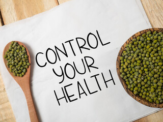 Control your health, text words typography written on paper against wooden background, life fitness...