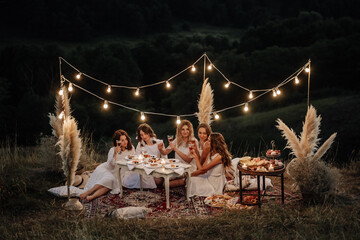 Girls Friends Relaxing Together on Night Picnic