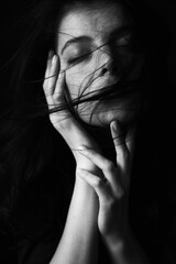 Emotional Sensual black and white portrait of a beautiful girl on a dark background