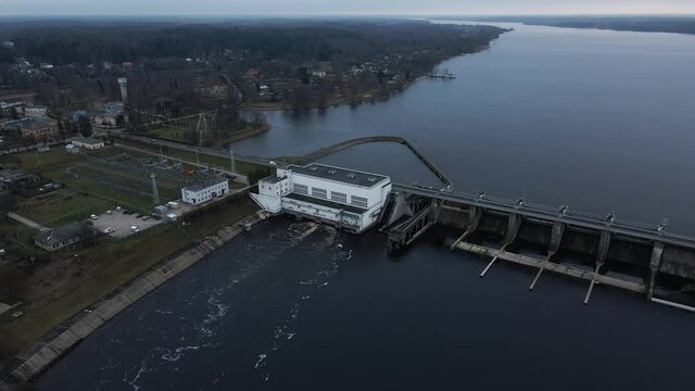 High quality aerial view over hydroelectric power plant in Kegums, Latvia nad river Daugava during daytime