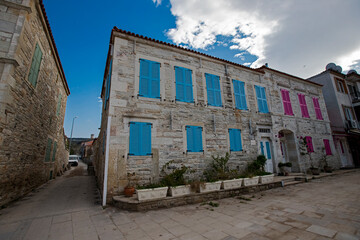 Turkey's Izmir - Former foça district of colored stone houses famous windowed view. Former foça Turkey is a popular historic tourist center.