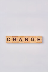 Change word made with building blocks. Concept of changing isolated on white background.