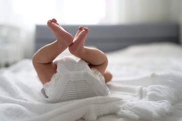 One week newborn adorable innocent baby lying at baycot and funny yawning.Portrait of sleepy...