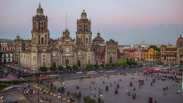 Time lapse view of historical landmarks Zocalo Square (Spanish: Plaza del Zocalo ) and Metropolitan Cathedral at sunset in the Historic Center of Mexico City, Mexico. 