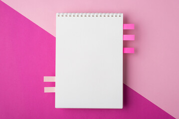 Top above overhead close up view photo of clear spiral document notepad with side stickers and place for design isolated half bright and pastel backdrop