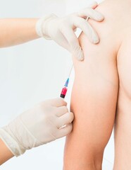 Nurse puts inoculation hand syringe