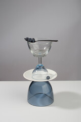 Still life composition of dishes with blueberries. Abstract design, food and drink concept.