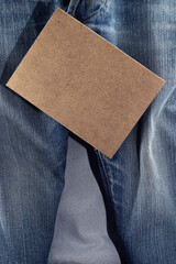 Sale concept with blue Jeans on background texture. Copy space for text or design
