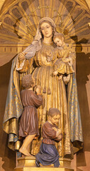 BARCELONA, SPAIN - MARCH 3, 2020: The baroque polychome carved satatue of Madonna in church...