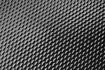 Dark metallic ellipse pattern texture background.
