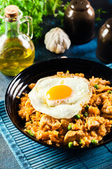 Spicy fried rice with chicken, kimchi and egg
