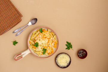 Pasta with pumpkin in white sauce