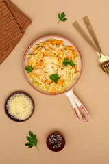 Pasta with pumpkin in white sauce