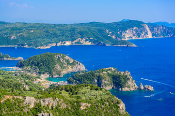 Fototapeta na wymiar View from Castle Angelokastro to the coast of Paleokastritsa - Paradise coastline scenery with crystal clear azure water in Bays - Corfu, Ionian island, Greece, Europe