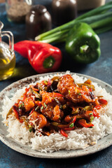 Sweet and sour chicken with colorful bell pepper with rice