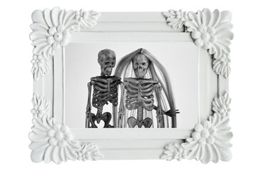 Cute couple of skeletons in photo frame. Family portraits in frame. Love never died concept. Happy Valentine's Day