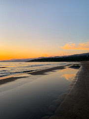 Fototapeta premium Beautiful orange sunset at the sand beach