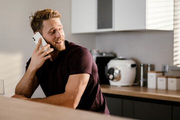 Handsome young man using mobile phone