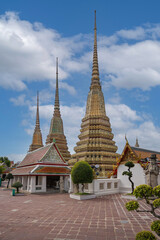 Fototapeta premium Beautiful stupas decorated with colorful mosaic at pagoda is Thai art architecture of Wat Pho temple is famous place and travel attraction in Bangkok, Thailand.