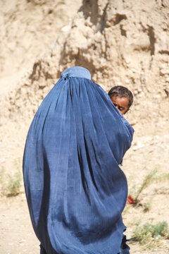 Daily refugee village life in Badghis, Afghanistan in the desert.